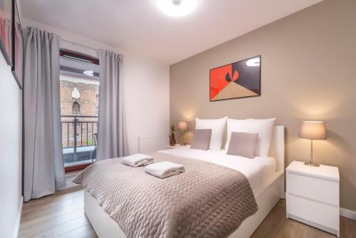 Łóżko lub łóżka w pokoju w obiekcie WaterLane Island - Old Town Apartments by Renters Prestige