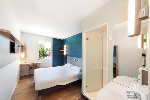 Postel nebo postele na pokoji v ubytování ibis budget Saint Gaudens