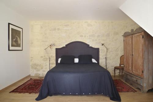 Ένα ή περισσότερα κρεβάτια σε δωμάτιο στο Domaine St Gilles - Maison entièrement climatisée, proche activités aquatiques et équestres