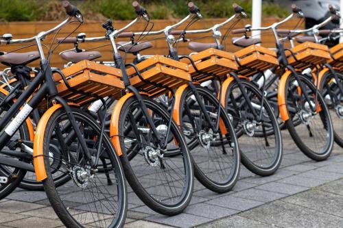 a row of bikes parked next to each other at Bilderberg Garden Hotel in Amsterdam