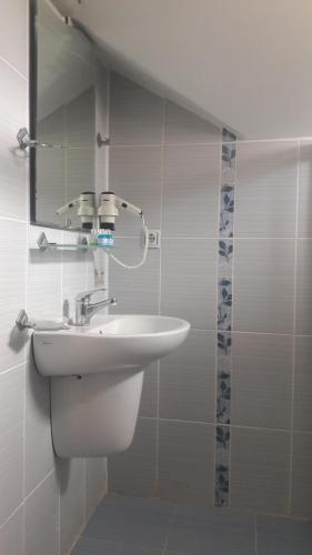a bathroom with a sink and a mirror at Rota Hotel in Dalyan