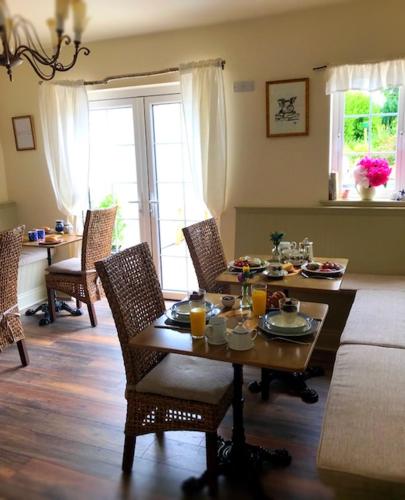 a living room with a table with food on it at The Happy Pig in Kenmare