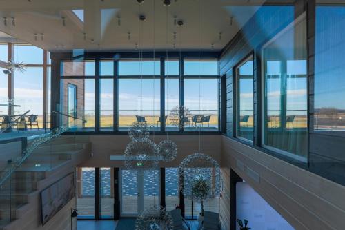 a view of a building with glass windows at Jurmala Golf Club&Hotel in Piņķi