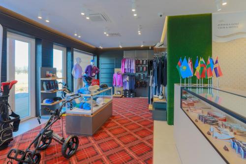 a clothing store with a scooter in the middle at Jurmala Golf Club&Hotel in Piņķi