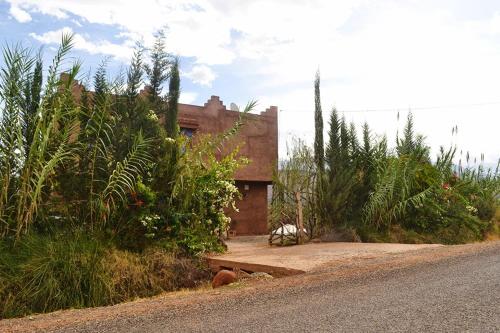 a house sitting on the side of a road at Villa Paradise in Aghmat