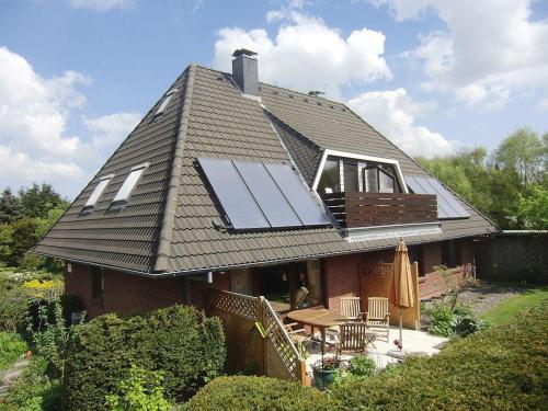 a house with solar panels on the roof at Haus Kahlke in Sankt Peter-Ording