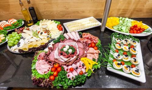 a bunch of different types of food on a table at Hotel Residence in Würzburg