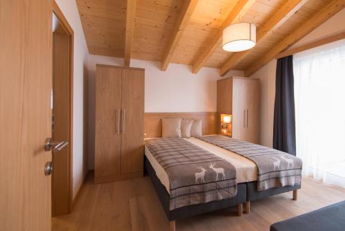 Ένα ή περισσότερα κρεβάτια σε δωμάτιο στο Apartment Dorf Wagrain Alpenleben by AlpenTravel