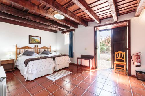 A bed or beds in a room at El Pósito