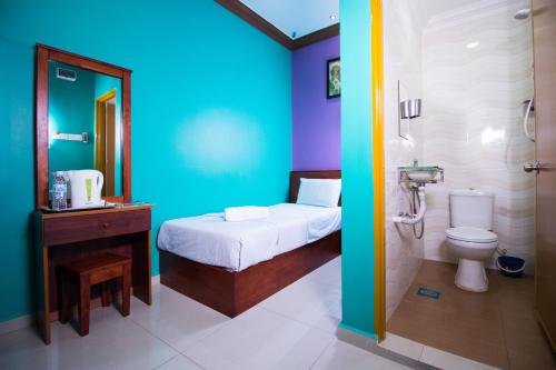 Ett badrum på Saujana City Hotel