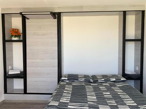 a bedroom with a bed and sliding glass doors at B&B Villa degli Angeli in Bernalda