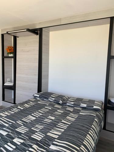 a bedroom with a bed and a sliding glass door at B&B Villa degli Angeli in Bernalda