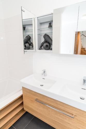 a bathroom with a sink and a mirror at Mint@Naschmarkt Premium Apartments in Vienna