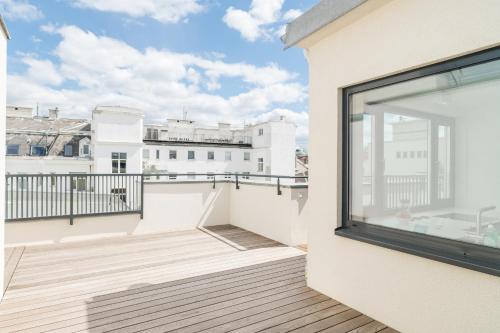 a balcony with a view of a building at Mint@Naschmarkt Premium Apartments in Vienna