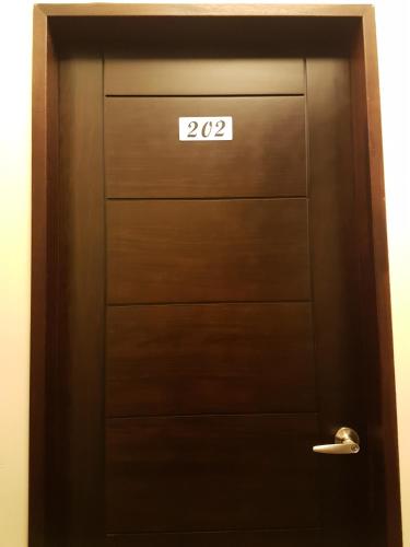 a door with the number on it at DuGu Hostel in Jinning