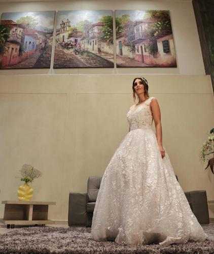 a woman in a wedding dress standing in a room at Hotel La Serrania Bucaramanga in Bucaramanga