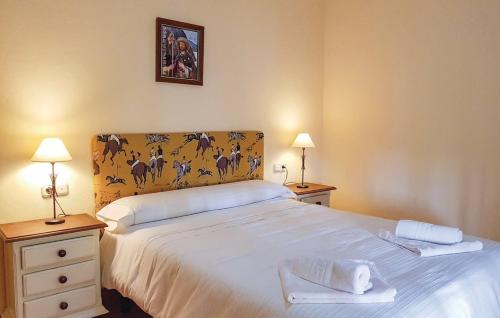 Un pat sau paturi într-o cameră la Casitas Sierra de Libar