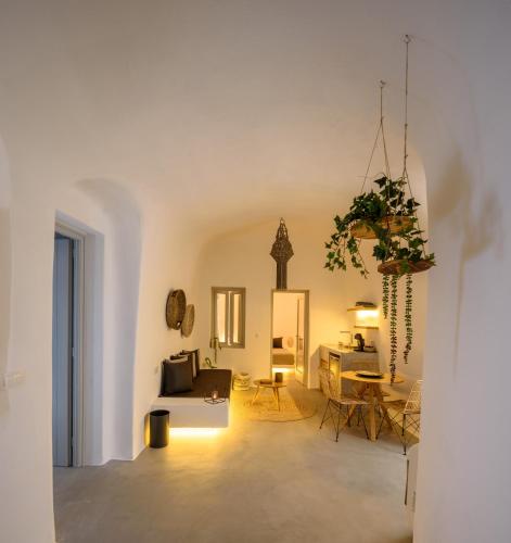 a living room with a couch and a table at Delilah Villa by Senses Collection in Pyrgos