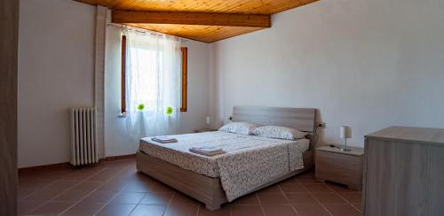 מיטה או מיטות בחדר ב-Agriturismo Il Maremmano