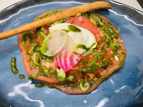a blue plate topped with food on top of sidx sidx sidx at L'Estirado des Adrets in Les Adrets de l'Esterel