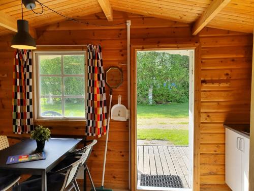 a kitchen with a door leading to a patio at City Camping Hjørring in Hjørring