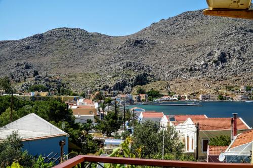 a view of a town with a mountain at Agnanti house in Symi