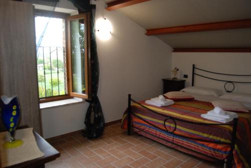 Postel nebo postele na pokoji v ubytování Agriturismo"Il Sagrato di Assisi" appartamenti,camere