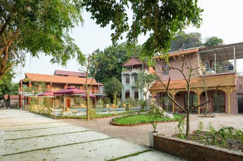 a house with a garden in front of it at Ruby Homestay in Ninh Binh