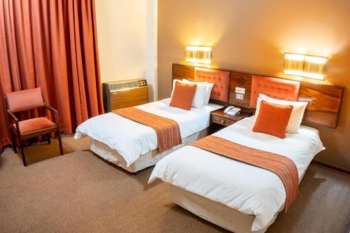 Łóżko lub łóżka w pokoju w obiekcie Elgro Hotel Potchefstroom