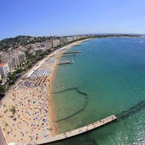 an aerial view of a beach with a crowd of people at Centre ville 10 min de la Croisette/Downtown in Cannes