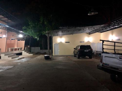 a car parked in a garage at night at chillchillsangkhlaburi โรงแรมชิลชิลสังขละบุรี in Sangkhla Buri