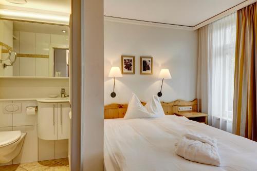 Llit o llits en una habitació de Hotel Meierhof