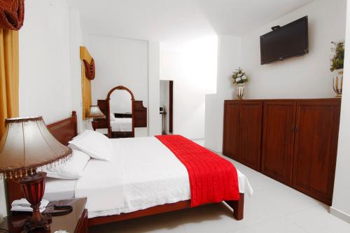 Katil atau katil-katil dalam bilik di Hotel Versailles Internacional