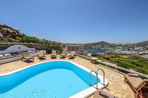 a swimming pool on top of a house at 9 Muses Villas Mykonos in Ornos