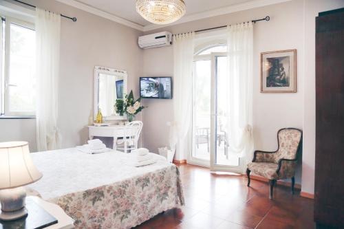 Postel nebo postele na pokoji v ubytování Villa Ortensia