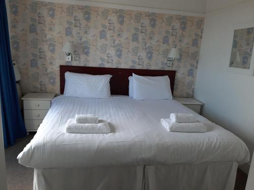 Ένα ή περισσότερα κρεβάτια σε δωμάτιο στο North Parade Seafront Accommodation