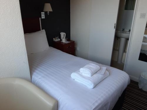 Ένα ή περισσότερα κρεβάτια σε δωμάτιο στο North Parade Seafront Accommodation