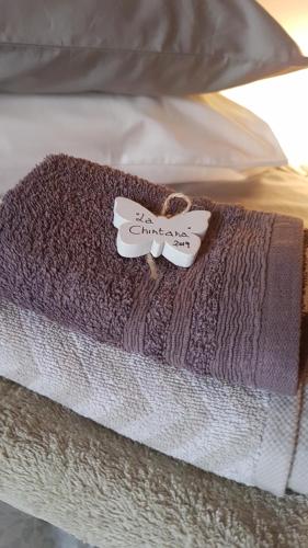 a blanket on top of a bed at La Chintana in Palmadula