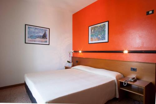Postel nebo postele na pokoji v ubytování Hotel Pace