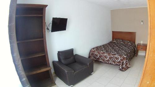 Katil atau katil-katil dalam bilik di Hotel San Luis