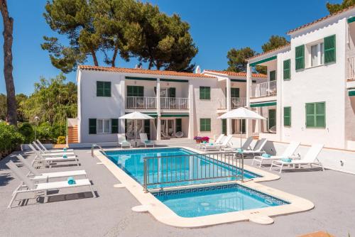 an image of a villa with a swimming pool at Apartamentos Annabel's II in Cala Galdana