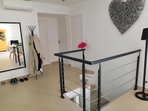 a staircase in a room with a mirror at Vue exceptionnelle in Mandelieu-la-Napoule