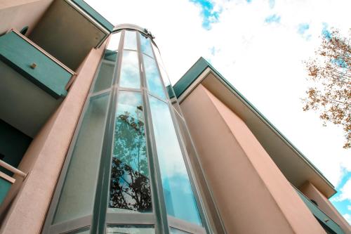 a glass elevator on the side of a building at Hotel Gaby in Rimini