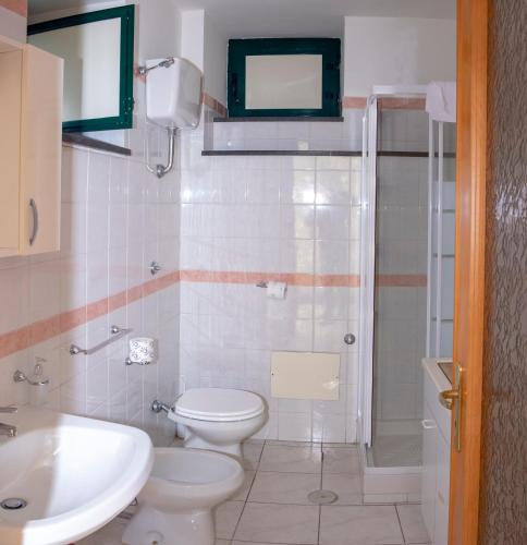 a bathroom with a toilet and a sink and a shower at B&B CASA VACANZA Cioffi in Vico Equense