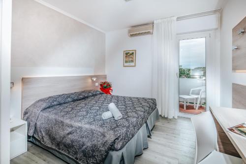 Postel nebo postele na pokoji v ubytování Hotel Ambassador Meuble