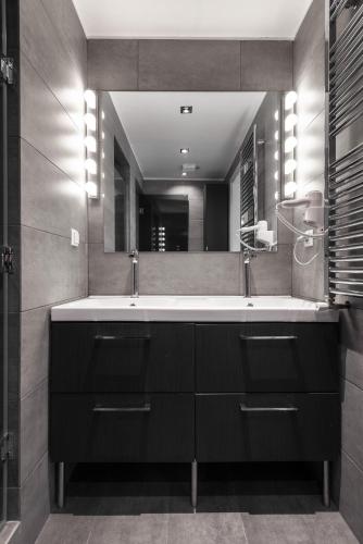 a bathroom with a sink and a mirror at Vourvourou Villa Mare Verde by Luxlikehome in Vourvourou