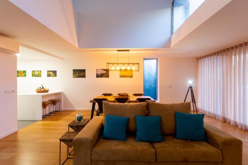 a living room with a couch and a table at H. S. Caloura in Lagoa