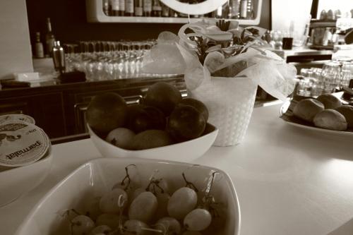 a table with bowls of fruit on a counter at Mille e Una Notte in Nuova Gibellina