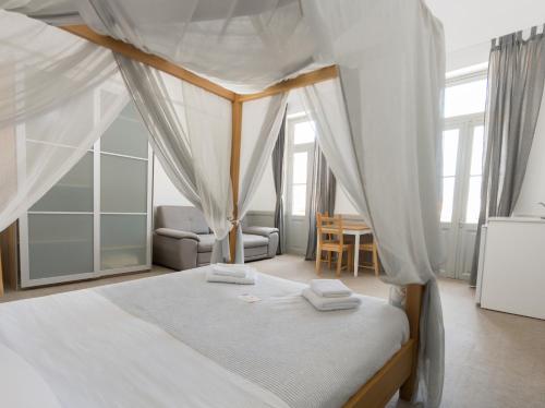 מיטה או מיטות בחדר ב-Douskos Guesthouse