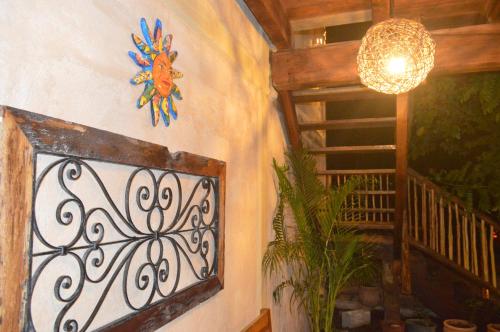 a room with a wall with a wrought iron fence at Hotel Casa San Juan in Valladolid